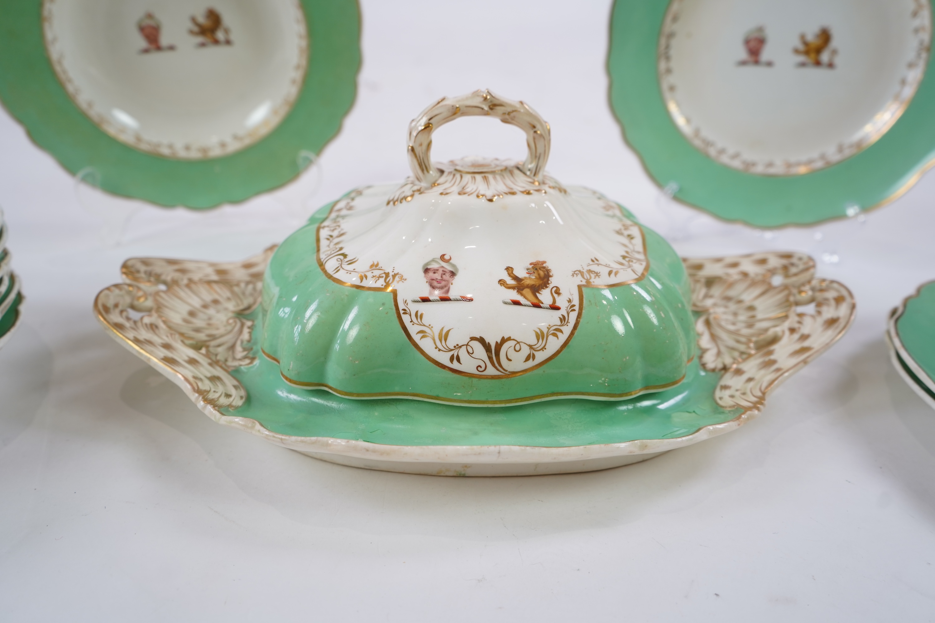 An English porcelain Turks head crested part dinner service, c.1830